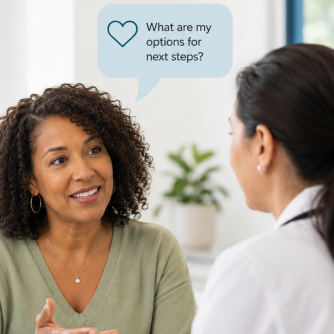 Woman discussing breast density questions with her doctor.